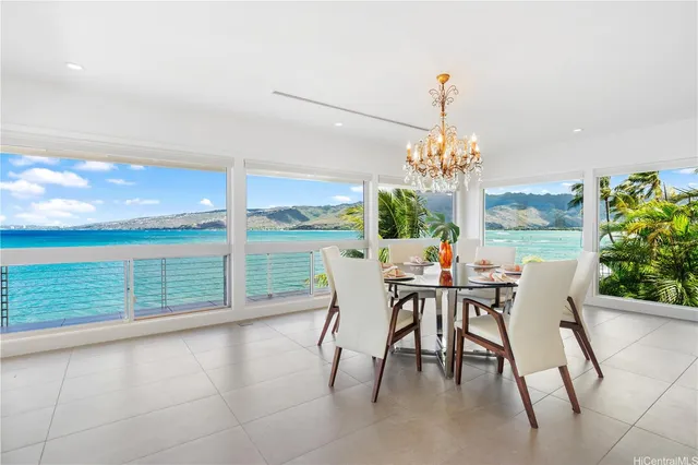 a bedroom with furniture and large window
