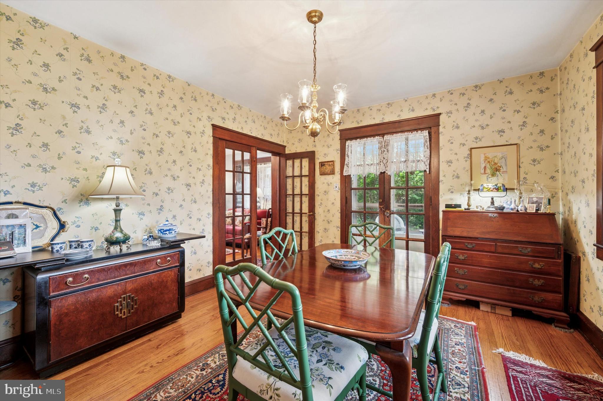 63 South Hillcrest Road Springfield, PA 19064 - Photo 12 of 32 a dining room with furniture a chandelier and wooden floor
