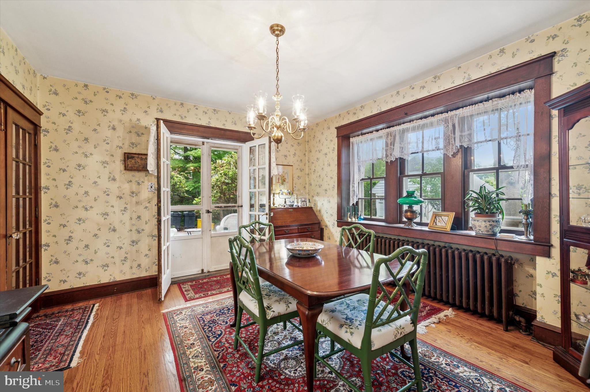 63 South Hillcrest Road Springfield, PA 19064 - Photo 13 of 32 a view of a dining room with furniture wooden floor and a chandelier
