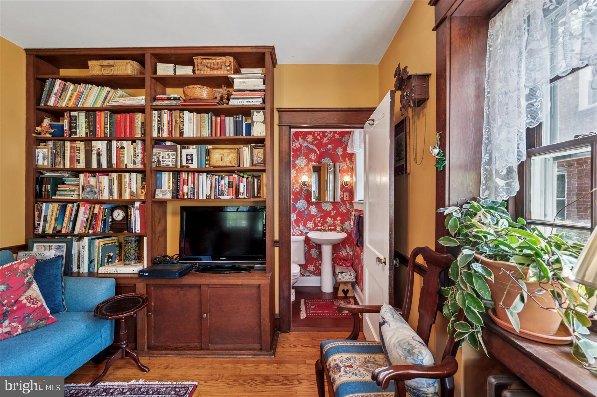 63 South Hillcrest Road Springfield, PA 19064 - Photo 21 of 32 a living room with furniture and a flat screen tv