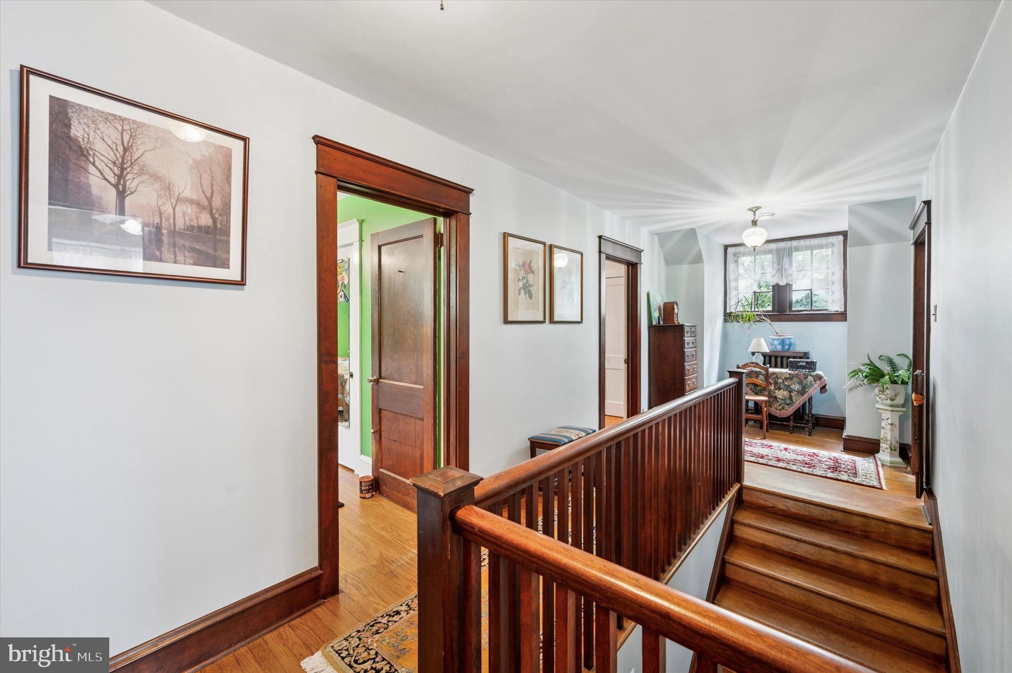 63 South Hillcrest Road Springfield, PA 19064 - Photo 22 of 32 a view of a hallway with wooden floor and stairs