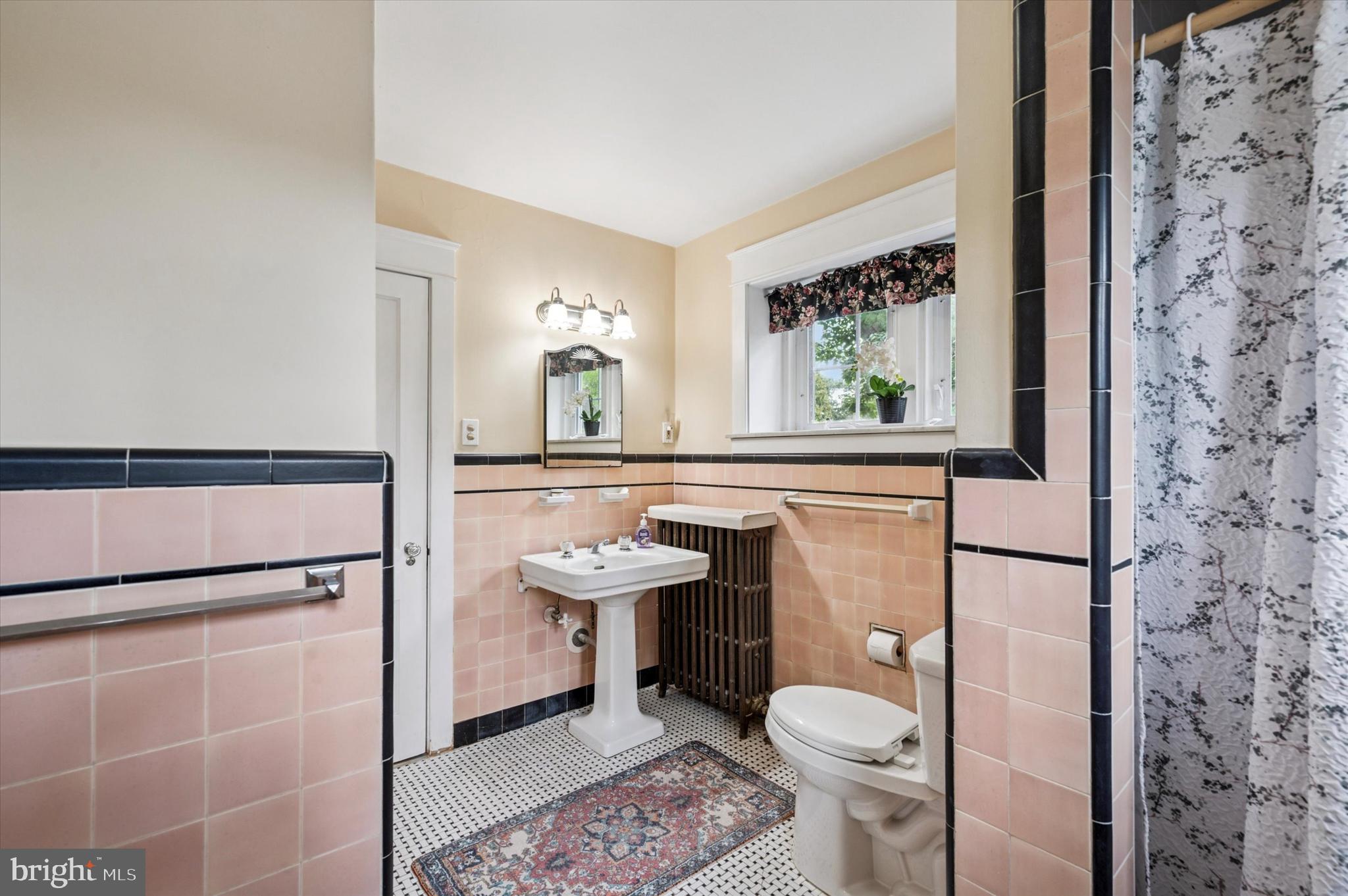 63 South Hillcrest Road Springfield, PA 19064 - Photo 26 of 32 a bathroom with a toilet a sink and a window