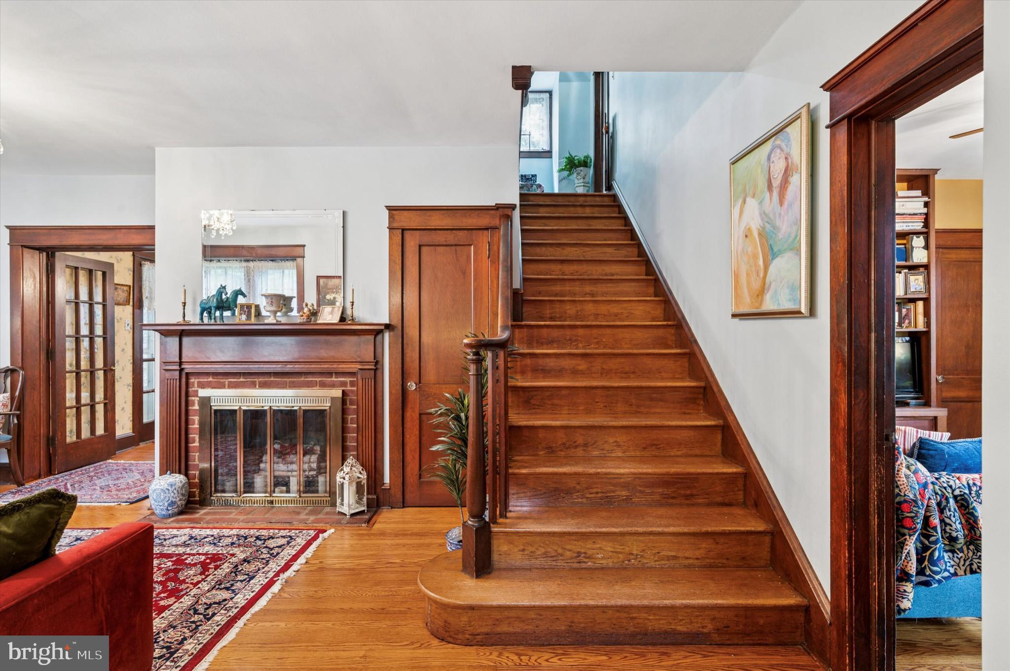 63 South Hillcrest Road Springfield, PA 19064 - Photo 4 of 32 a living room with wooden floor and a fireplace