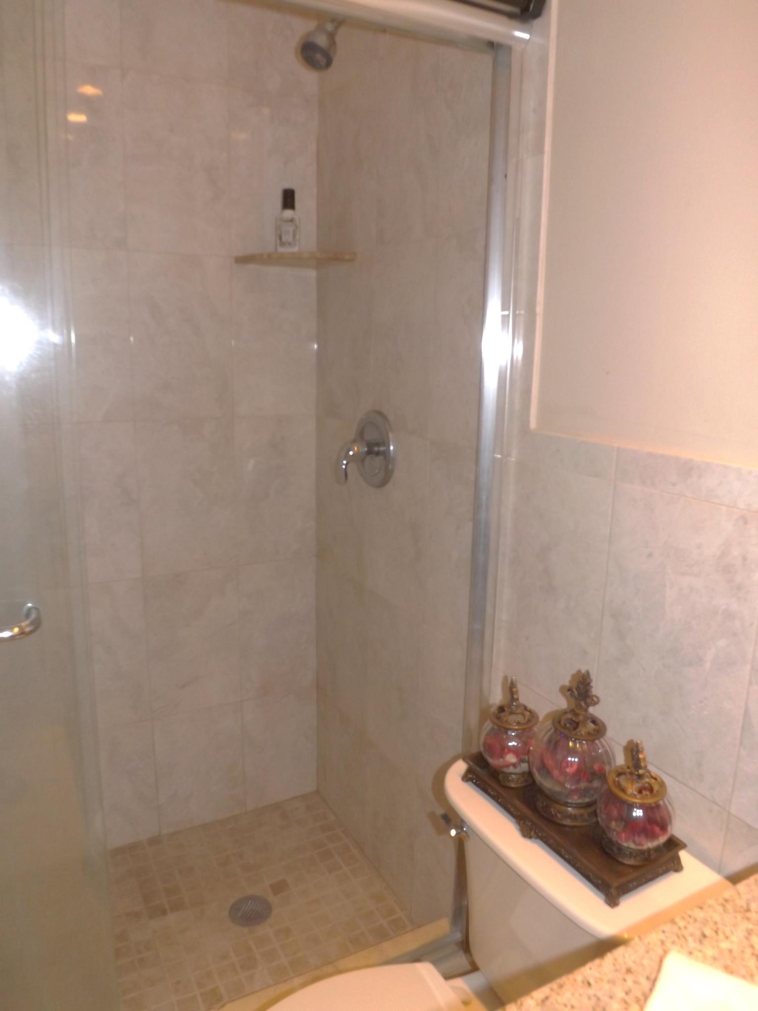 64 Davis Road Palm Springs, FL 33461 - Photo 23 of 32 a bathroom with a sink