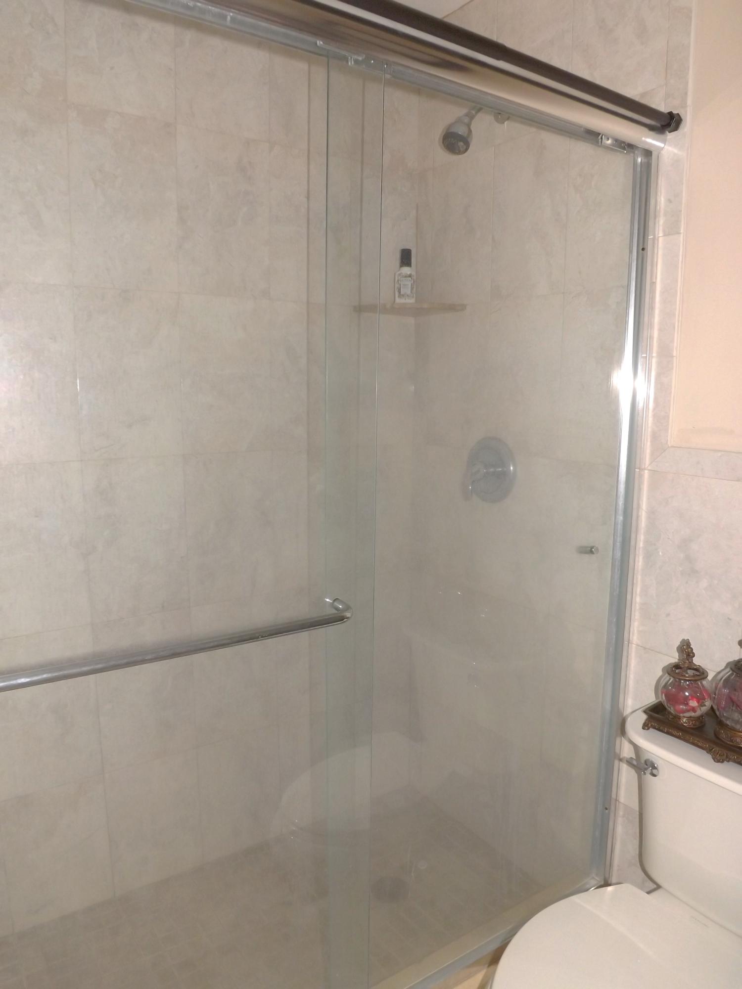 64 Davis Road Palm Springs, FL 33461 - Photo 25 of 32 a bathroom with a shower and a toilet