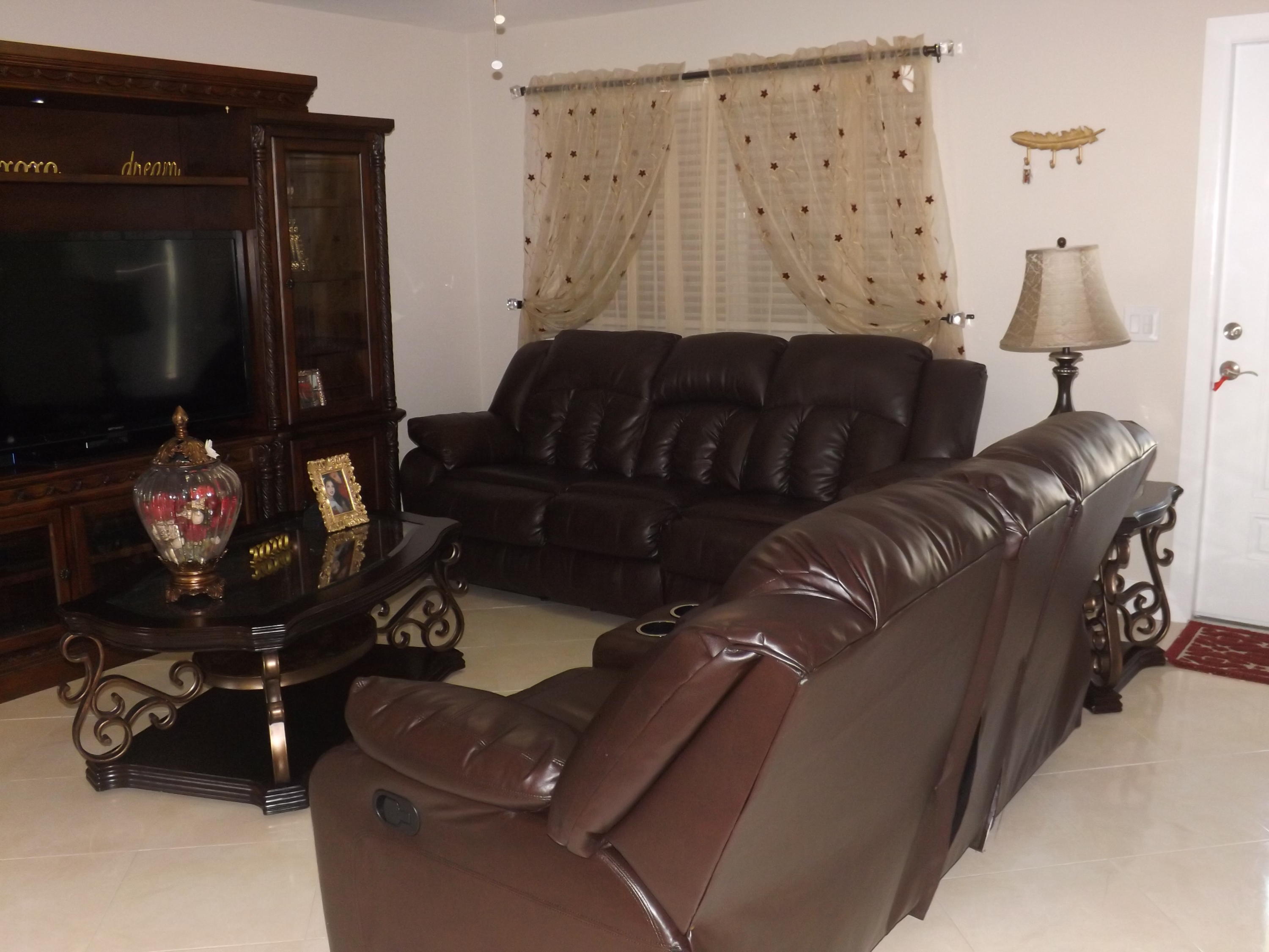 64 Davis Road Palm Springs, FL 33461 - Photo 4 of 32 a living room with furniture