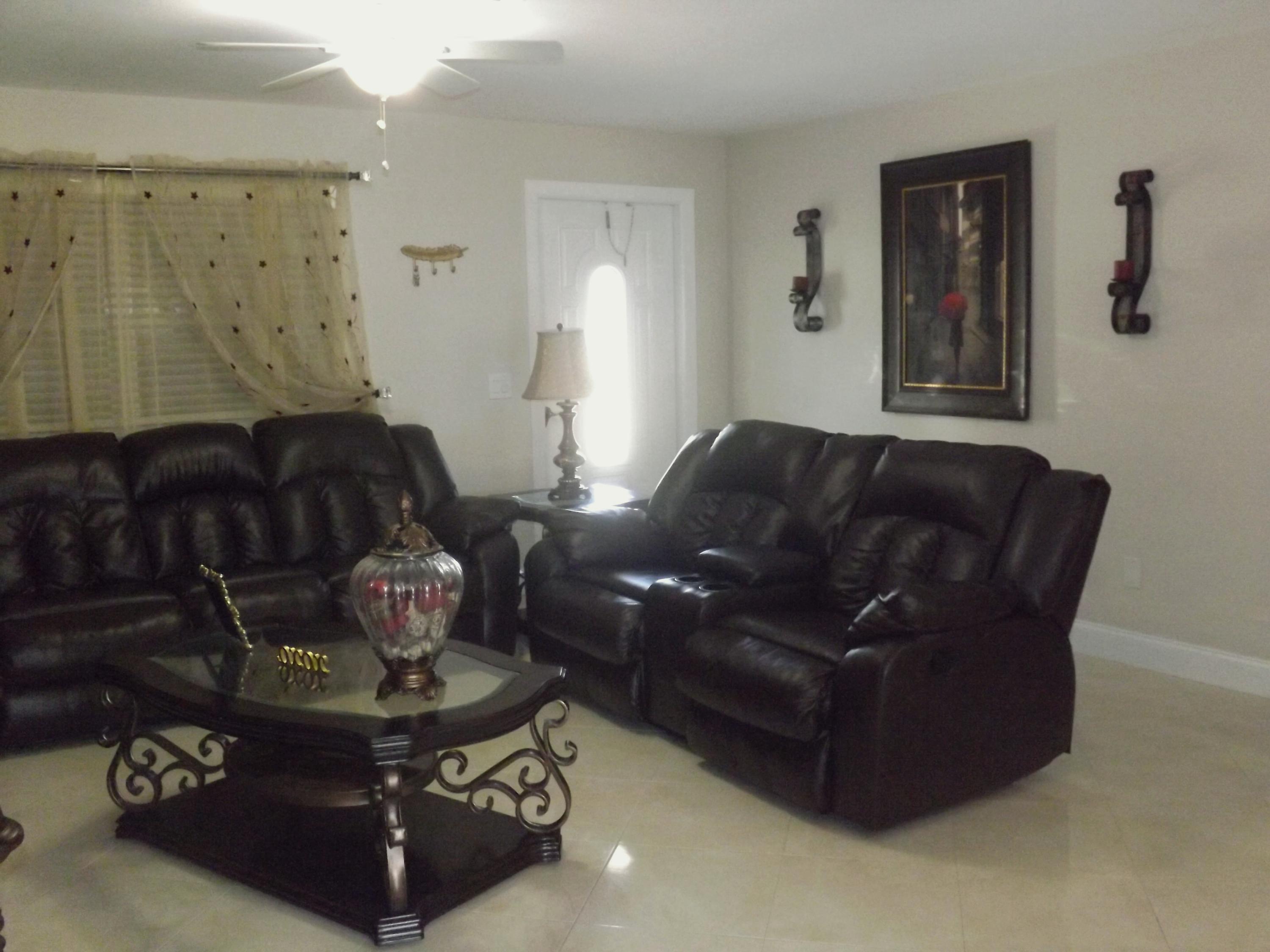 64 Davis Road Palm Springs, FL 33461 - Photo 5 of 32 a living room with furniture