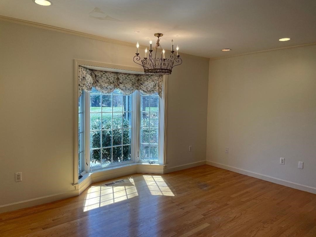 2 Windpath East, Unit 2 West Springfield, MA 01089 - Photo 20 of 41 a view of a room with wooden floor chandelier and a window