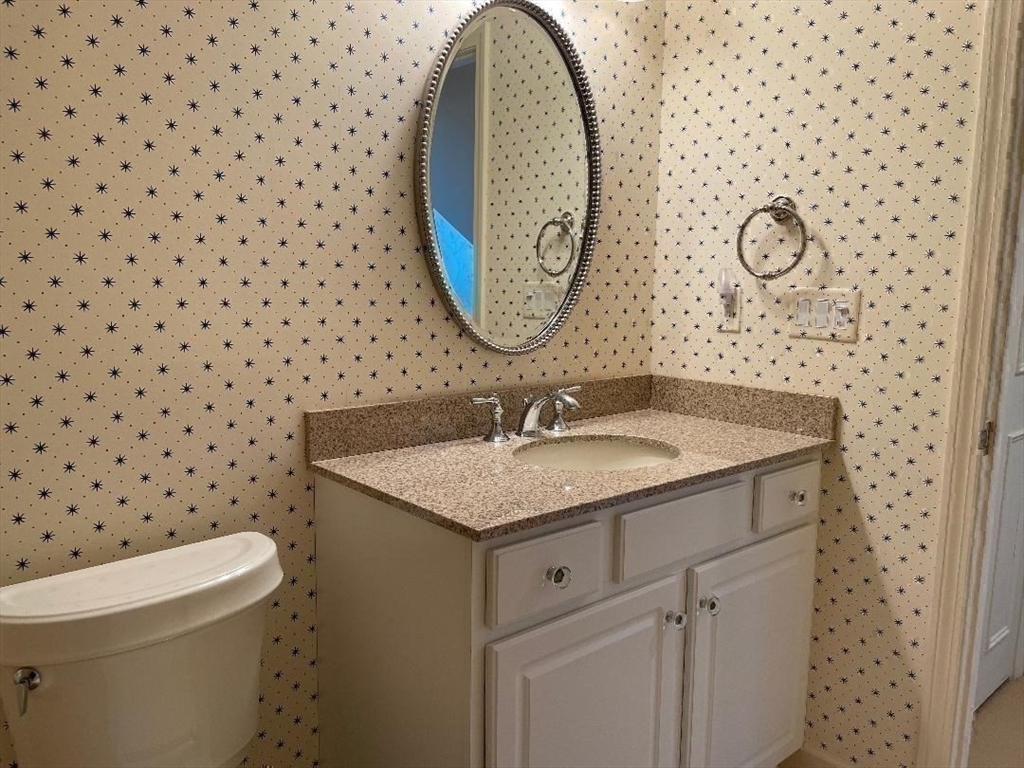 2 Windpath East, Unit 2 West Springfield, MA 01089 - Photo 37 of 41 a bathroom with a granite countertop sink and a mirror