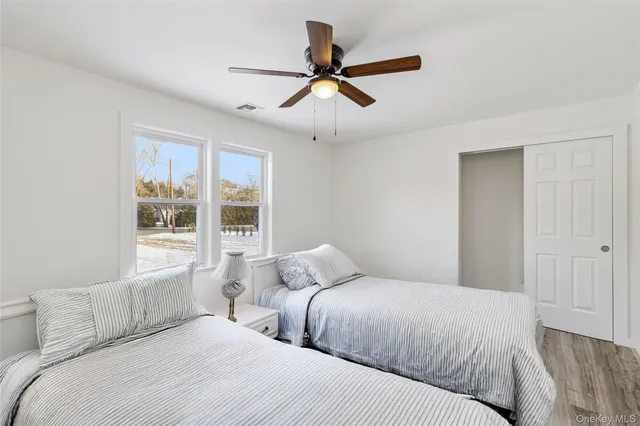 a bedroom with a large bed and a window
