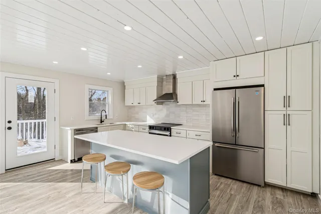 a view of an empty room with a fireplace and a window