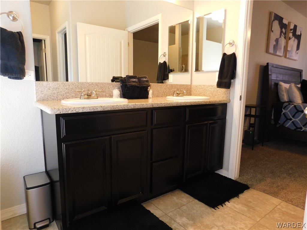 3370 South Ridge Avenue Bullhead City, AZ 86429 - Photo 39 of 56 a bathroom with a sink and a mirror