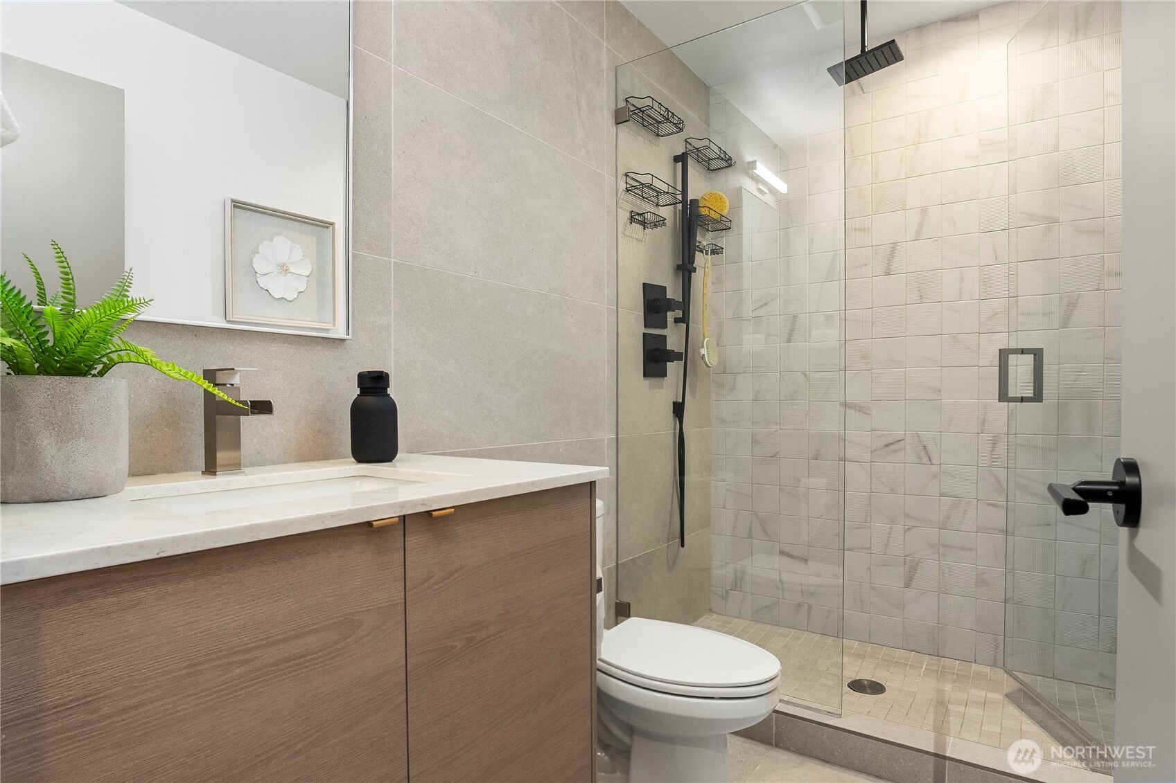 4758 Green Lake Way North Seattle, WA 98103 - Photo 15 of 26 a bathroom with a granite countertop sink a toilet and shower