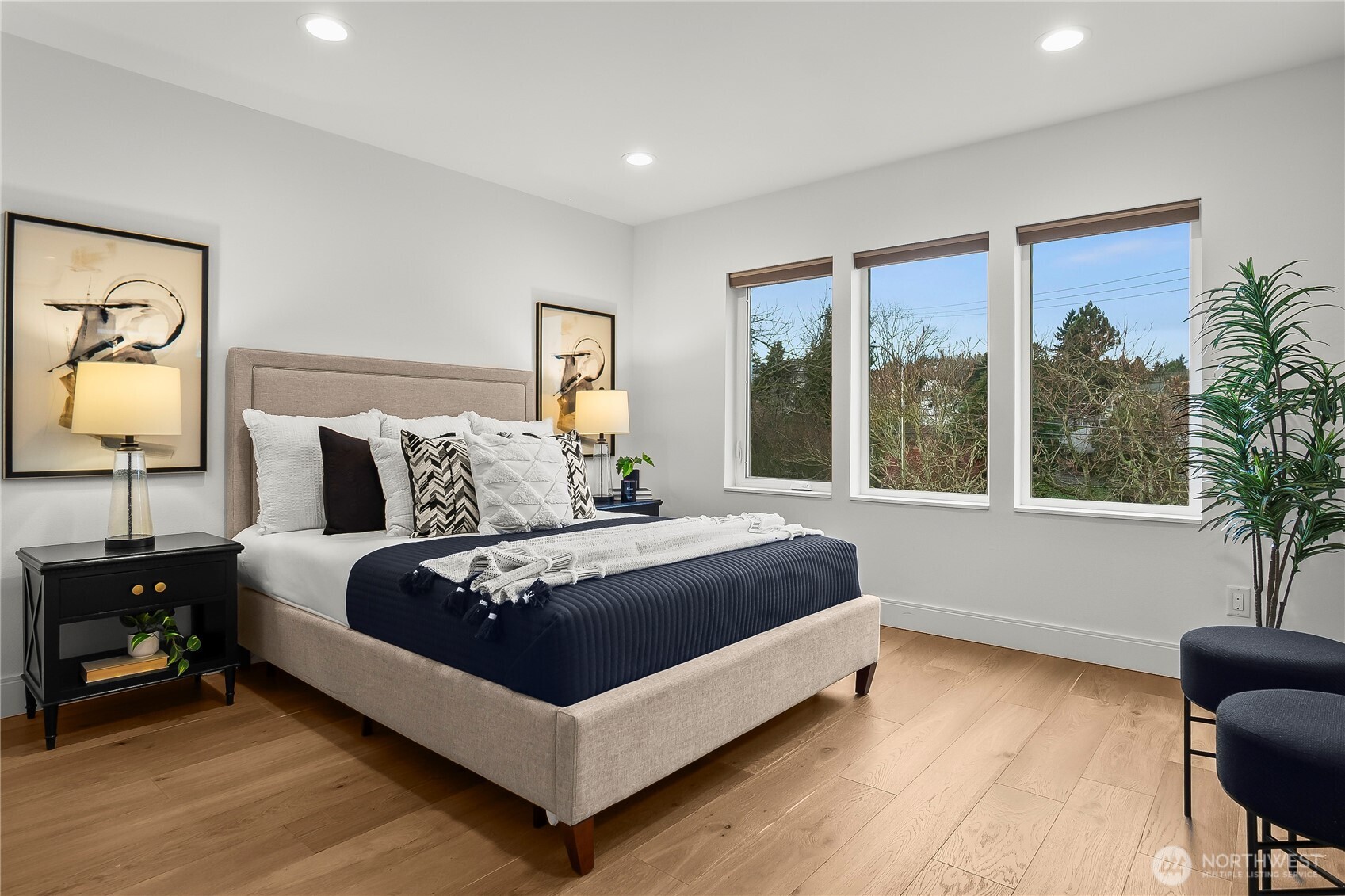 4758 Green Lake Way North Seattle, WA 98103 - Photo 18 of 26 a large bedroom with a bed and wooden floor