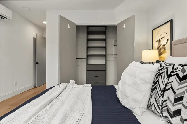 a bedroom with a bed and a closet