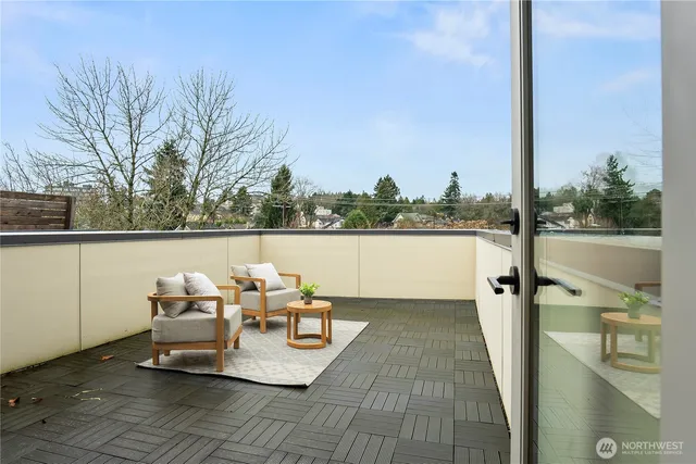 a view of a chairs and table on the terrace