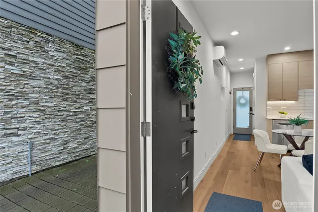 a hallway with a potted plant on the wall