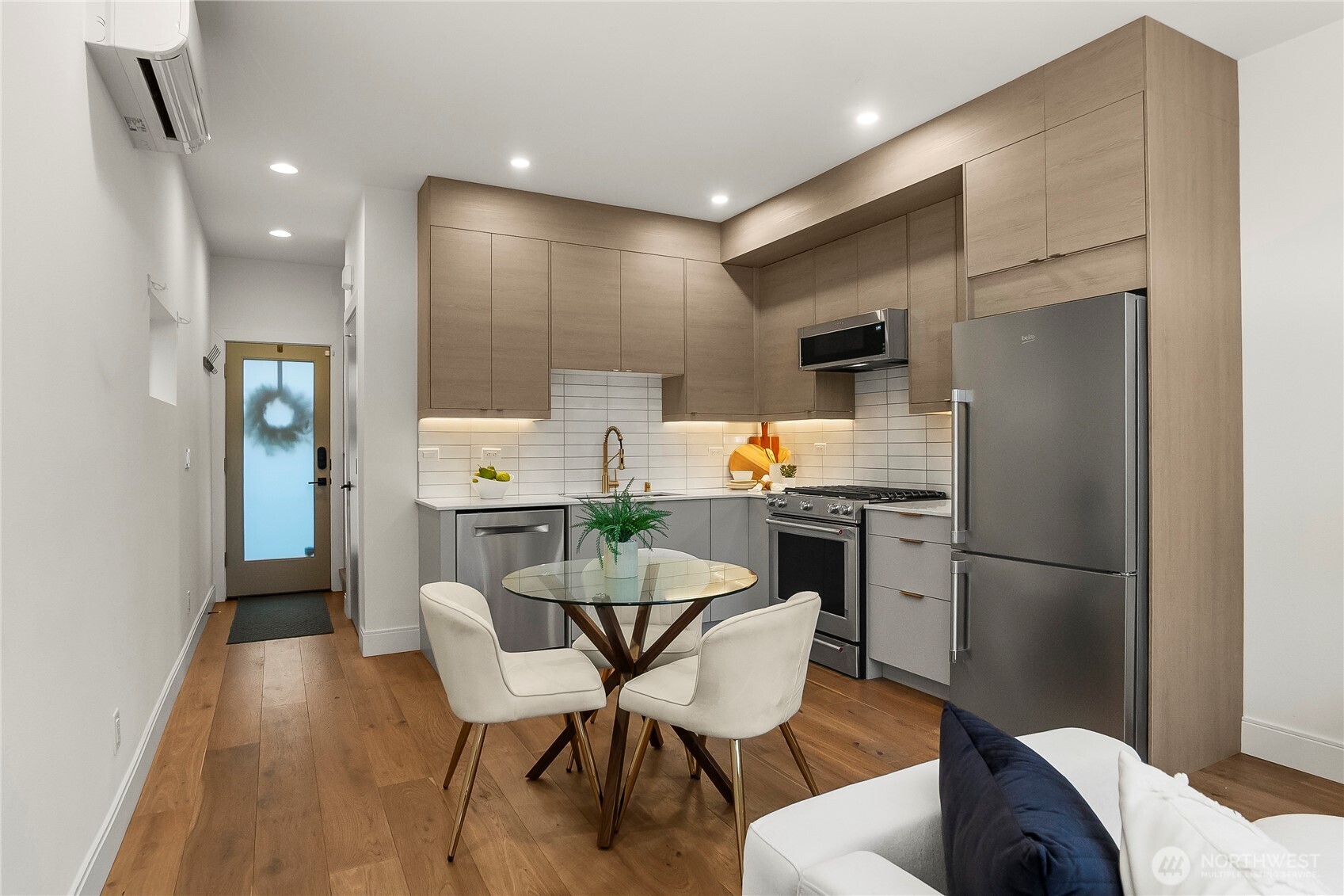 4758 Green Lake Way North Seattle, WA 98103 - Photo 5 of 26 a kitchen with stainless steel appliances a refrigerator and a dining table