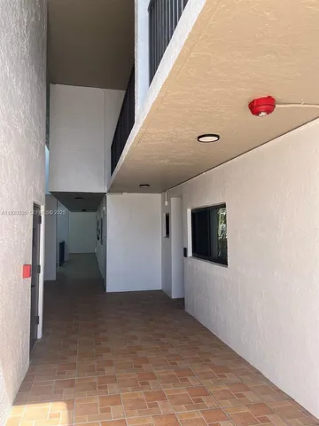 a swimming pool with outdoor seating and yard