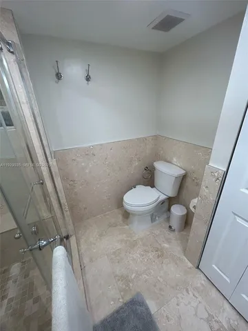 a kitchen with a sink and a stove top oven