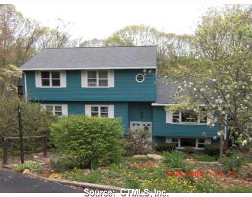 34 Dickinson Road Marlborough, CT 06447 - Photo 1 of 1 a front view of a house with a yard