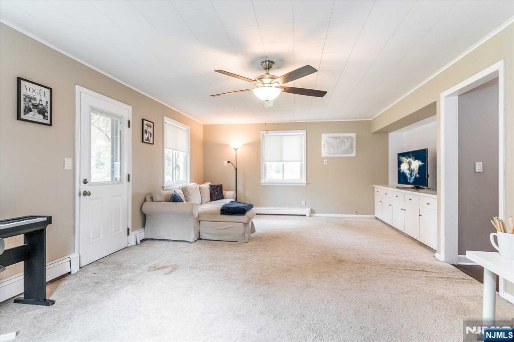 354 Plaza Road Fair Lawn, NJ 07410 - Photo 12 of 39 a living room with furniture and a window