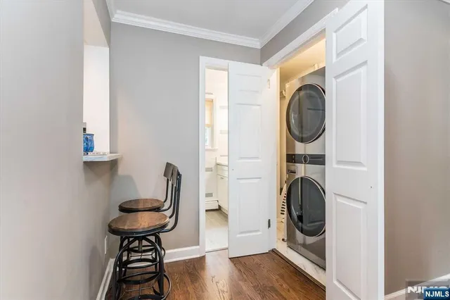 a view of a hallway with washer and dryer