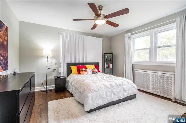 a bedroom with a bed and a table