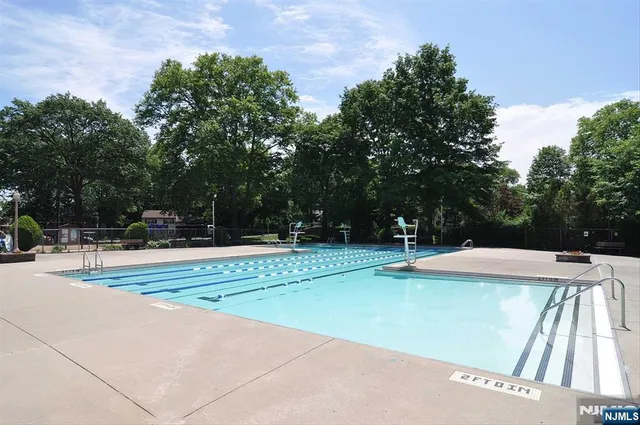 a view of outdoor space with swimming pool and patio