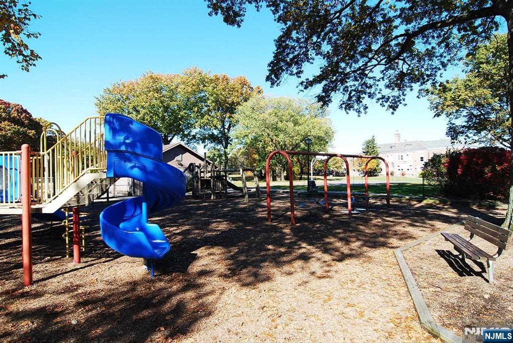354 Plaza Road Fair Lawn, NJ 07410 - Photo 37 of 39 a view of a house with backyard water fountain and sitting area