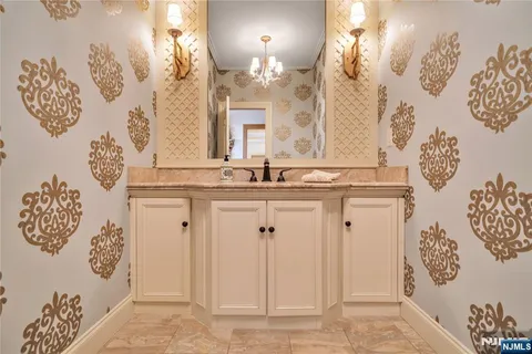 a bathroom with a mirror and a sink