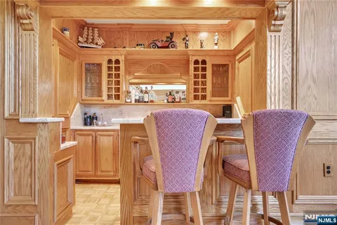 a dining room with furniture a rug and wooden floor