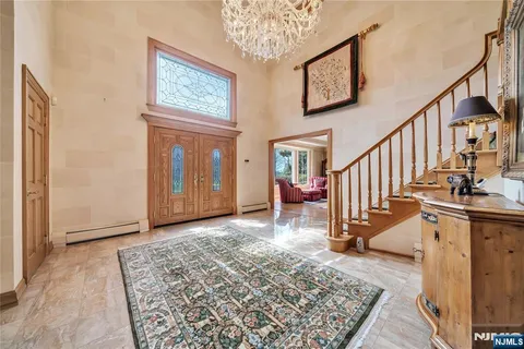 a view of an entryway with wooden floor