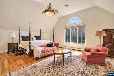 a living room with furniture fireplace and window