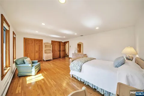a bed room with a bed and a large window