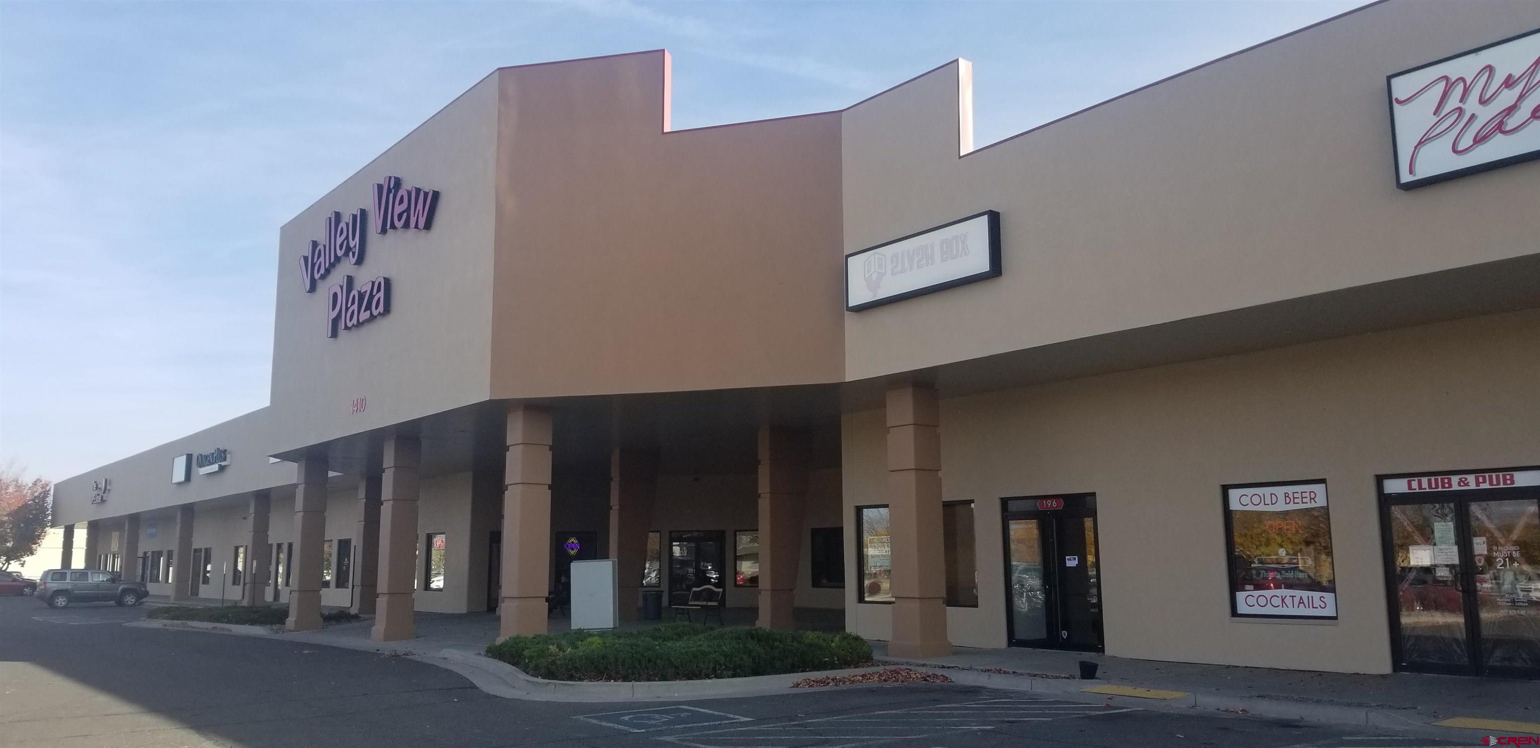 a view of a building with traffic signal lights
