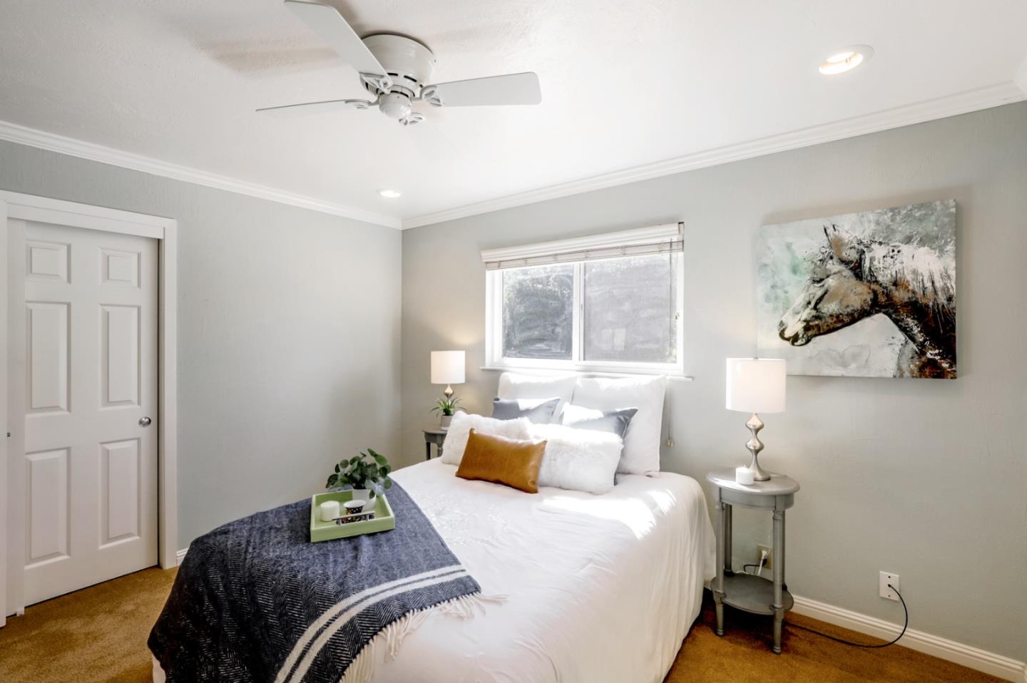 9580 Burchell Road Gilroy, CA 95020 - Photo 22 of 71 a bedroom with a bed and a chandelier