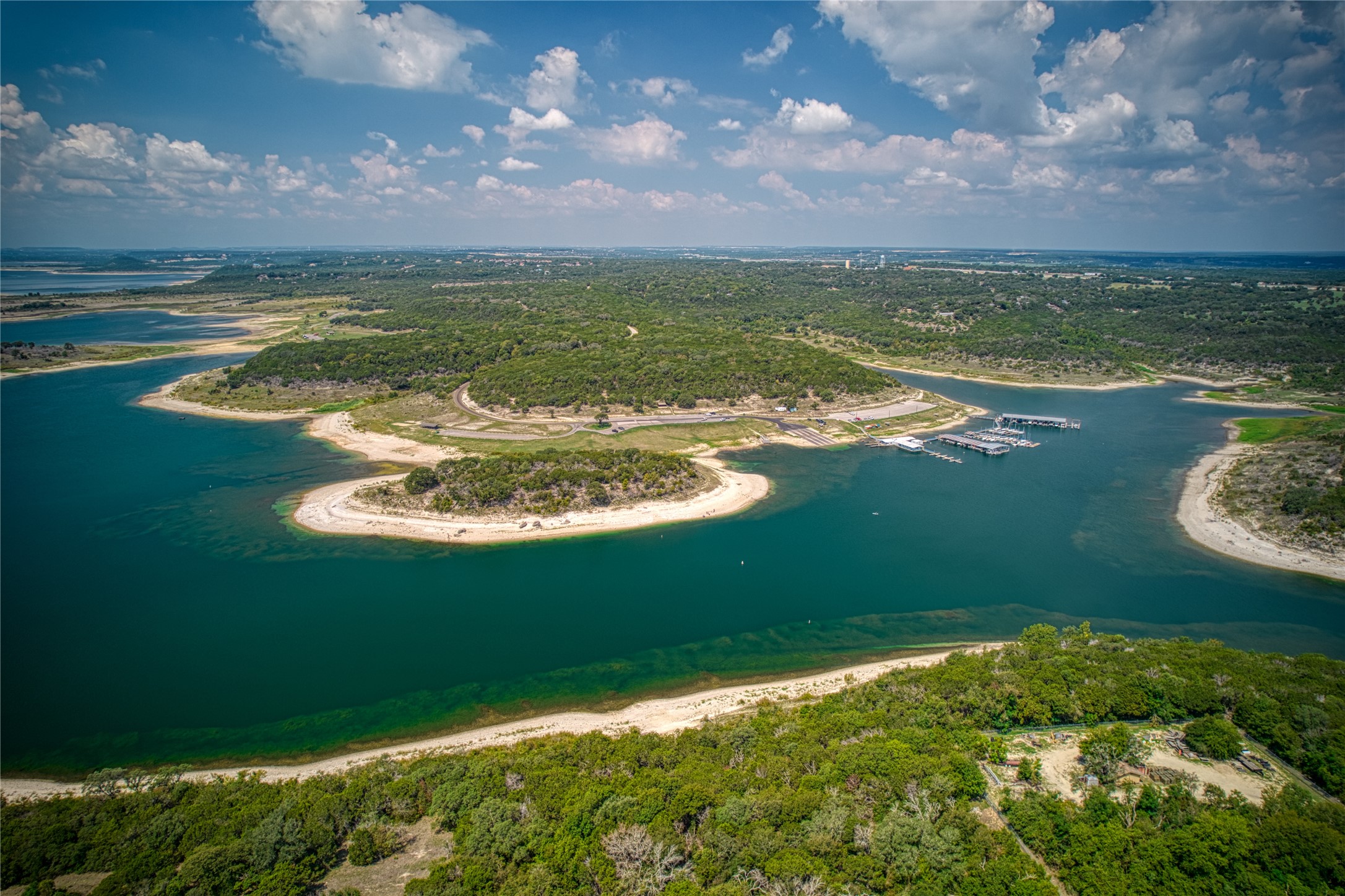 1670 Fm 1670 Whisper Trail Road Belton, TX 76513 - Photo 14 of 17 Aerial view of waterfront with a beach and a forest