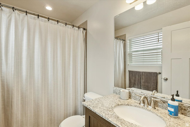 287 North 100th West Morgan, UT 84050 - Photo 17 of 27 Full bath with vanity and curtained shower
