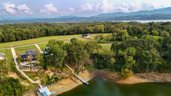 a view of lake with green space