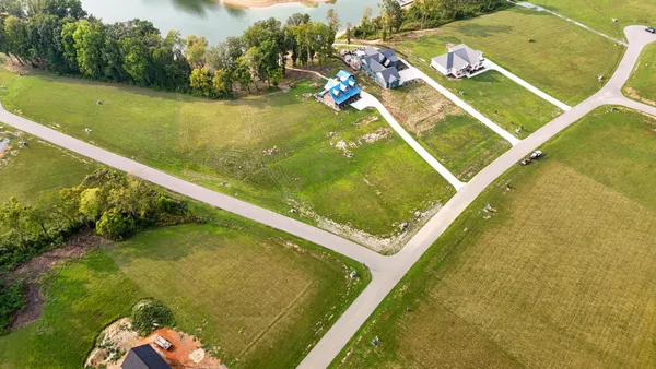 a view of a pool in a balcony with wooden floor