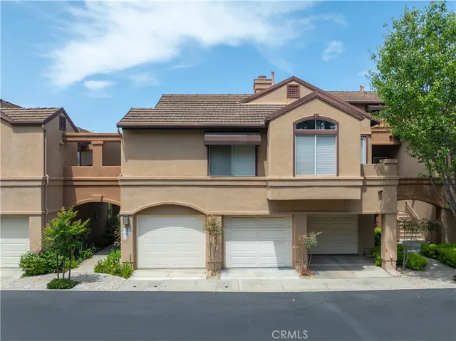 a view of a street with cars parked