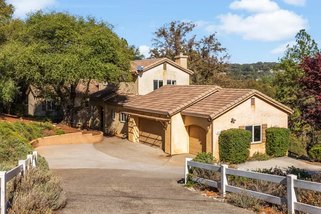 a aerial view of a house with a yard