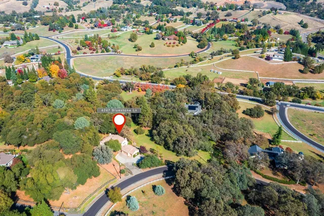 an aerial view of a house with a outdoor space