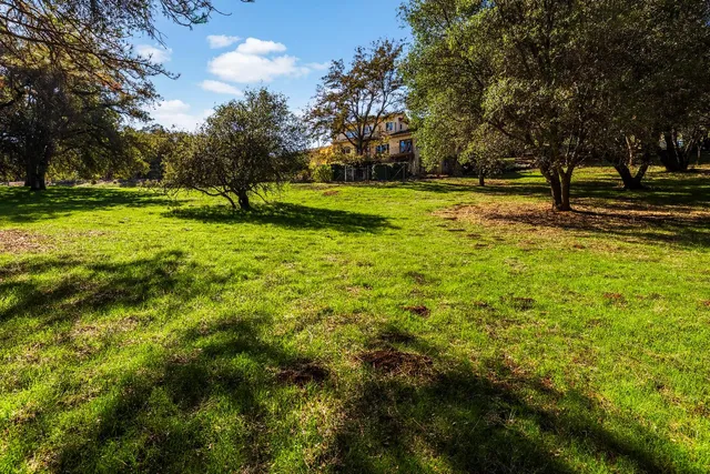 a view of a house with a big yard