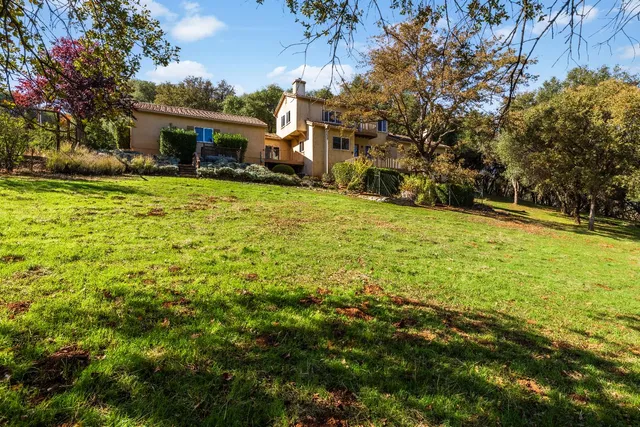 a backyard of a house with lots of green space