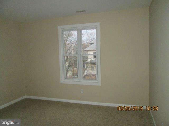 5414 Tramore Road Baltimore, MD 21214 - Photo 13 of 24 an empty room with a window
