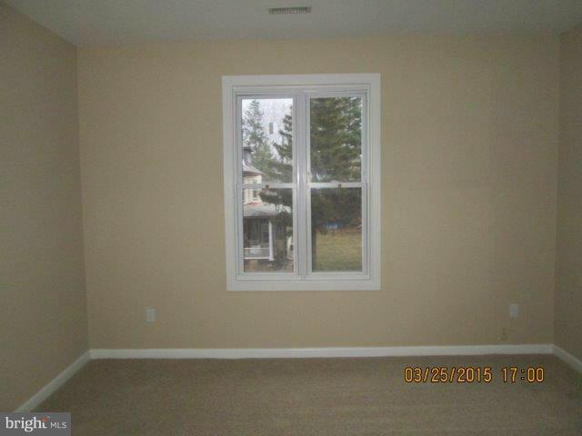 5414 Tramore Road Baltimore, MD 21214 - Photo 15 of 24 a view of an empty room with a window