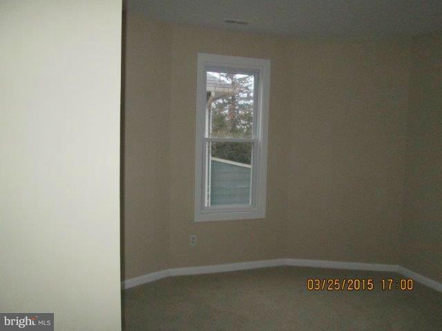 5414 Tramore Road Baltimore, MD 21214 - Photo 17 of 24 an empty room with windows