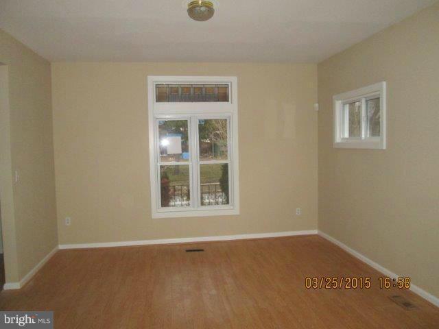 5414 Tramore Road Baltimore, MD 21214 - Photo 7 of 24 a view of an empty room with a window